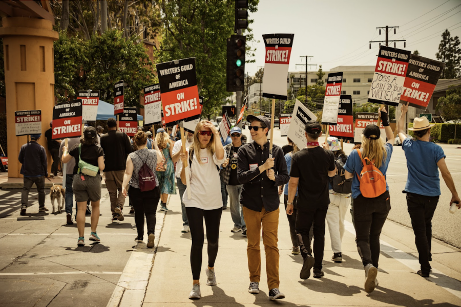 Screenwriters along the picket line near Walt Disney Studios while striking for adequate compensation. Their contract renegotiation requests were denied after streaming giants unjustly refused to adjust their residual payments.
