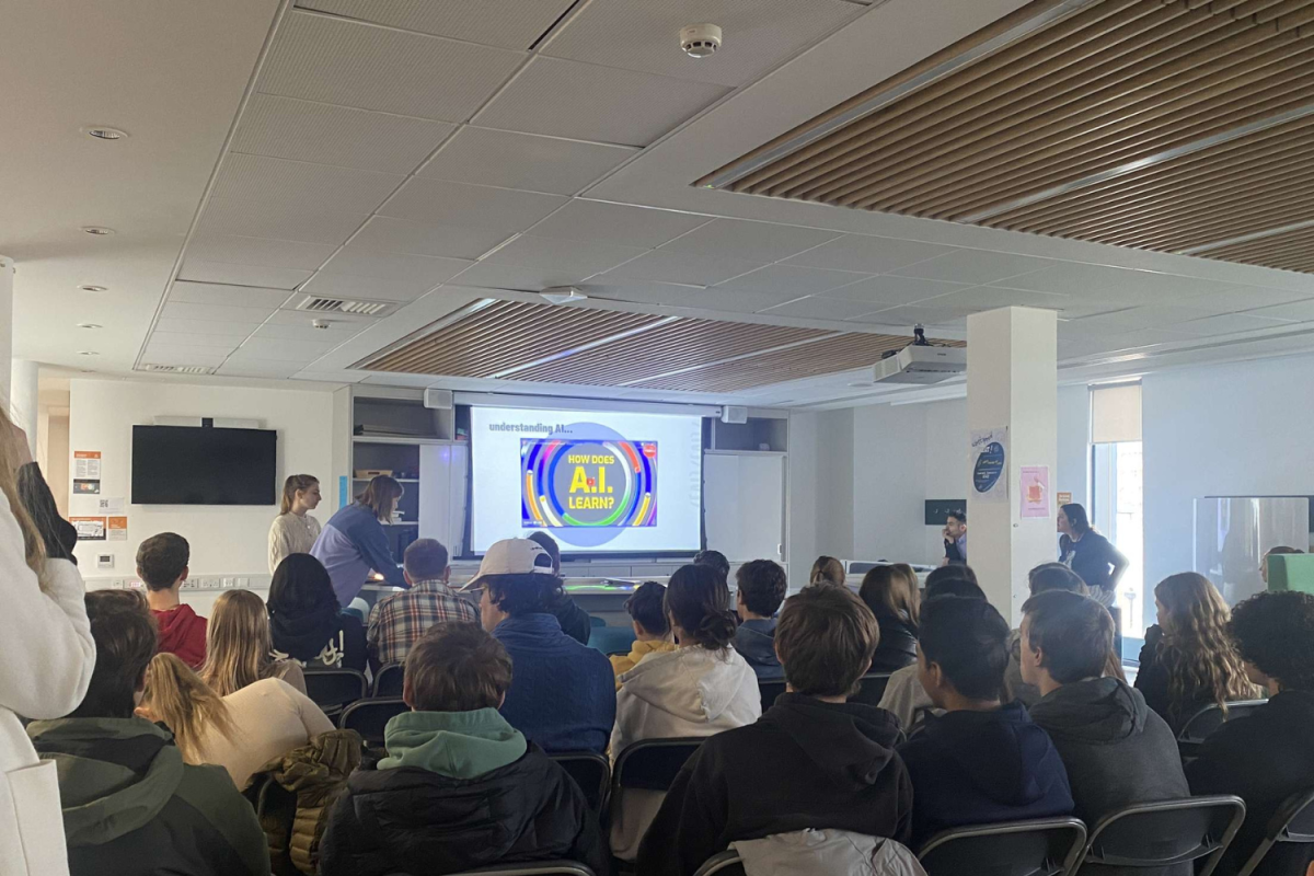 Students listen while Saoirse Burlingame (’24) and Sofia Limena (’24) present a workshop about bias in artificial intelligence during Aequitas Week in March 2023. This year, Aequitas will take place over the course of a whole day and contain a simulation portion.